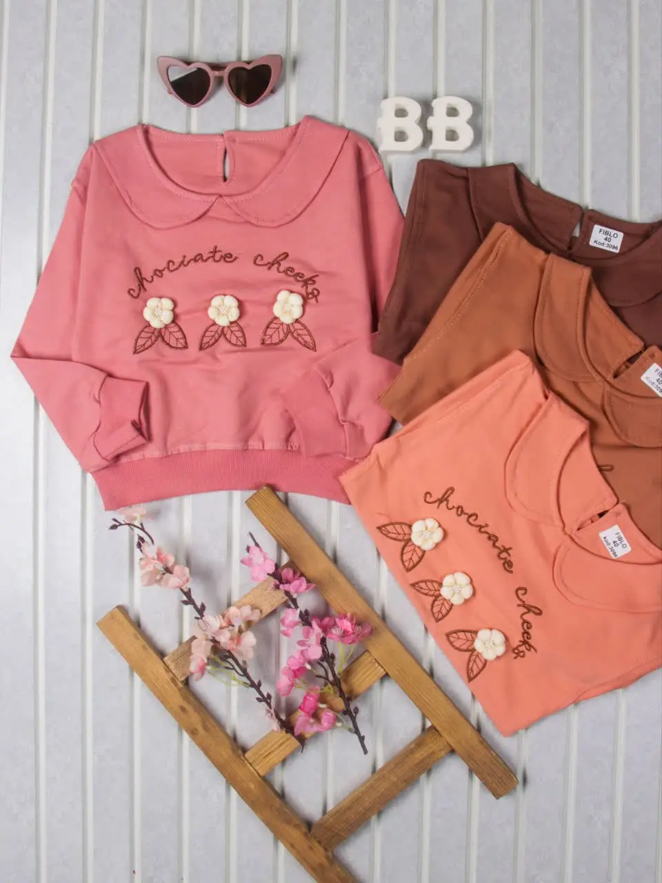 💢بلوز تک یقهB سه گل برجسته💢