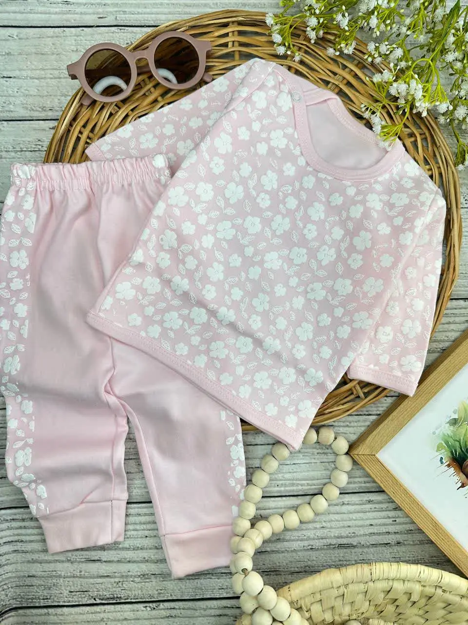 بلوز شلوار طرح شکوفه صورتی نوزادی و کودک کد ۱۷۳۱۹۸ 
