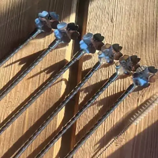 قاشق نی دار مارپیچ طرح گل نقره‌ای
